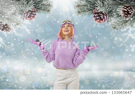 Girl in a purple sweater smiles with arms outstretched Girl in a purple sweater smiles with arms outstretched 133065647