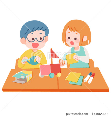 Elementary school boys and girls sitting at a desk and working together Elementary school boys and girls sitting at a desk and working together 133065668