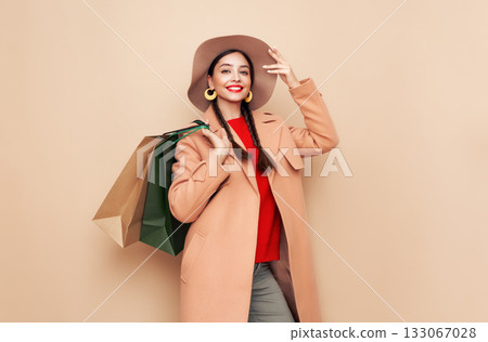 Autumn portrait of young woman with shopping bag Autumn portrait of young woman with shopping bag 133067028
