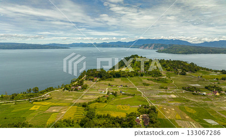 Aerial drone of lake Toba and agricultural land in the countryside in the highlands. Sumatra, Indonesia. Aerial drone of lake Toba and agricultural land in the countryside in the highlands. Sumatra, Indonesia. 133067286