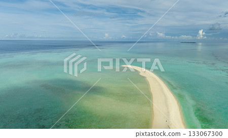 Aerial view of sandy beach with crystal clear water in the tropics. Timba Timba islet. Tun Sakaran Marine Park. Borneo, Sabah, Malaysia. Aerial view of sandy beach with crystal clear water in the tropics. Timba Timba islet. Tun Sakaran Marine Park. Borneo, Sabah, Malaysia. 133067300