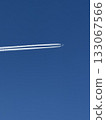 Airplane in the blue sky with contrails. 133067566