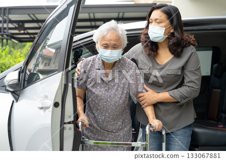 Asian senior woman patient sitting on walker prepare get to her car, healthy strong medical concept. 133067881