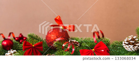 New Year Christmas tree toy, branches of a christmas tree, New Year decorations on a colored background 133068034