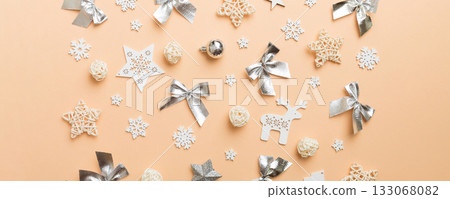 New Year composition white christmas snowflakes. Christmas decor background with pine cones. Top view with copy space New Year composition white christmas snowflakes. Christmas decor background with pine cones. Top view with copy space 133068082