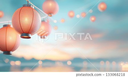 Delicate Pink Lanterns Hanging Against a Soft Focus Sky at Sunset in a Tranquil Setting 133068218