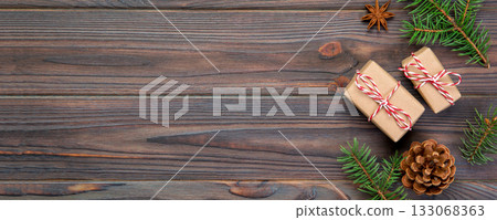 Christmas background with copy space, top view. holiday concept for you design on wooden table Christmas background with copy space, top view. holiday concept for you design on wooden table 133068363