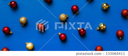 Christmas composition. a pattern of christmas balls on colored background. Flat lay, top view New year decor Christmas composition. a pattern of christmas balls on colored background. Flat lay, top view New year decor 133068411