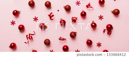 Christmas composition. a pattern of christmas balls on colored background. Flat lay, top view New year decor Christmas composition. a pattern of christmas balls on colored background. Flat lay, top view New year decor 133068412
