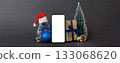 Digital phone mock up with rustic Christmas decorations for app presentation with empty space for you design. Christmas online shopping concept. Tablet with copy space on colored background 133068620