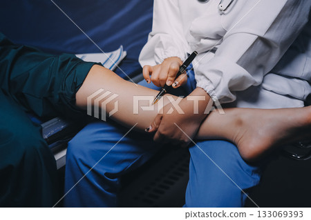 Rehabilitation therapy Professional male physiotherapists working in rehabilitation centers while treating male patients with leg and muscle pain. 133069393