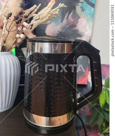 Stylish Black Kettle on a Countertop Stylish Black Kettle on a Countertop 133069591