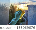 Washing the windows while watching the sunset 133069676