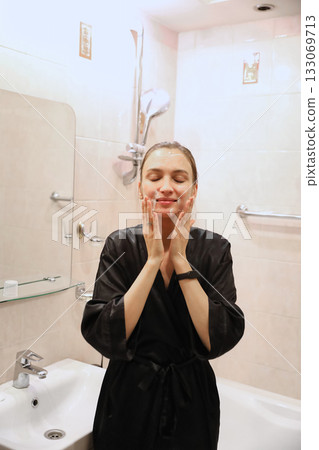 Woman Applying Face Cream, Bathroom Routine 133069713