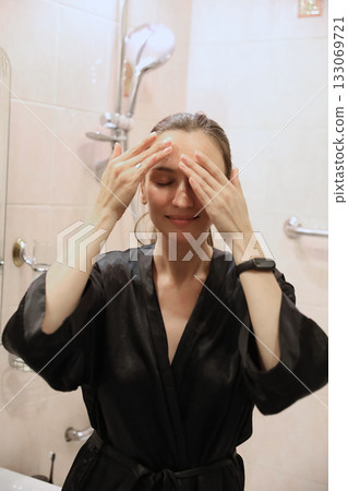Woman Applying Face Cream, Bathroom Routine Woman Applying Face Cream, Bathroom Routine 133069721