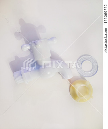 White Plastic Faucet with Parts Isolated 133069732