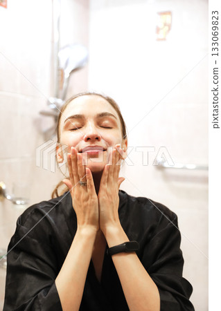 Woman Applying Face Cream, Bathroom Routine Woman Applying Face Cream, Bathroom Routine 133069823