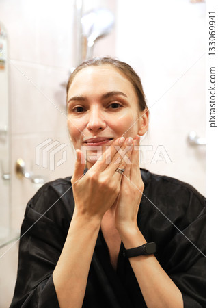 Woman Applying Face Cream, Bathroom Routine 133069941