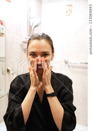 Woman Applying Face Cream, Bathroom Routine Woman Applying Face Cream, Bathroom Routine 133069943