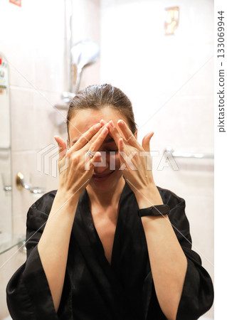 Woman Applying Face Cream, Bathroom Routine Woman Applying Face Cream, Bathroom Routine 133069944