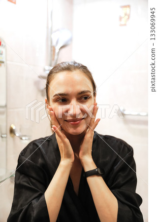 Woman Applying Face Cream, Bathroom Routine Woman Applying Face Cream, Bathroom Routine 133069945