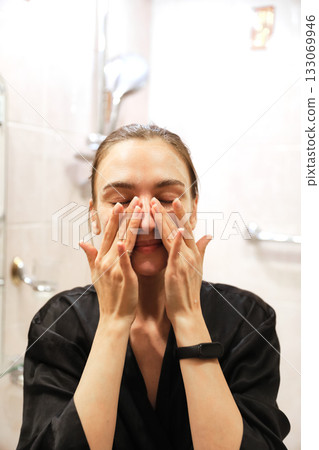 Woman Applying Face Cream, Bathroom Routine 133069946