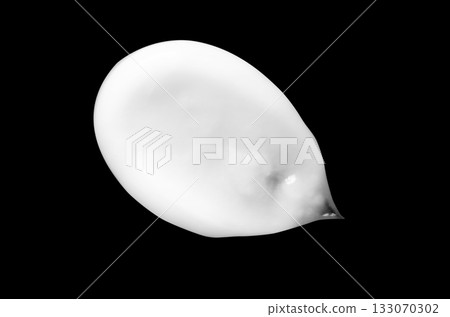 A sample of white body cosmetics on a black background A sample of white body cosmetics on a black background 133070302