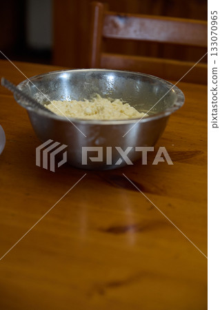 Pancake Batter: Metal Bowl on Wooden Table Surface Pancake Batter: Metal Bowl on Wooden Table Surface 133070965