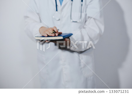Portrait of female doctor, holding file Portrait of female doctor, holding file 133071231