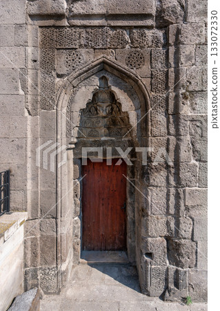 Alaca Kumbet, 13th-century Seljuk tomb entrance with intricate carvings, Kayseri, Turkey. 133072330
