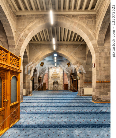 Interior view of Kayseri Grand Mosque, or Ulu Camii prayer hall with stone arches and blue carpet, Kayseri, Turkey 133072522