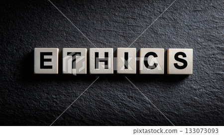The term 'Ethics' spelled out with square letter tiles on a dark stone surface. Concept representing moral principles, integrity, and professional conduct in business and life. The term 'Ethics' spelled out with square letter tiles on a dark stone surface. Concept representing moral principles, integrity, and professional conduct in business and life. 133073093