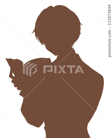 Boy reading silhouette small book Boy reading silhouette small book 133073694