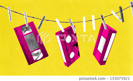 Collage art with hanging VHS tapes on string with playful nostalgic mood in retro film grain look 133073921