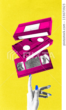 Bold poster. Vibrant floating VHS tapes above expressive hand in bold retro film grain style 133073923