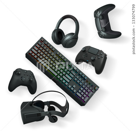 Gaming keyboard with RGB lighting, controllers, VR headset, and headphones isolated on white background with clipping path 133074799
