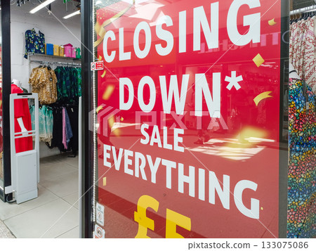 Closing Down Sale Sign at Retail Shop Window Advertising Everything 133075086