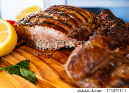 Horizontla close- up of various cuts of grilled meat ready to eat, creating a tempting and traditional culinary experience.Perfect for gourmet cooking advertisements. Horizontla close- up of various cuts of grilled meat ready to eat, creating a tempting and traditional culinary experience.Perfect for gourmet cooking advertisements. 133076114