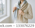 A woman wearing a muffler 133076229