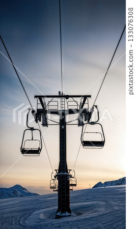 Ski lift towers and cables silhouetted against dramatic winter sky low angle industrial alpine infrastructure Ski lift towers and cables silhouetted against dramatic winter sky low angle industrial alpine infrastructure 133076308