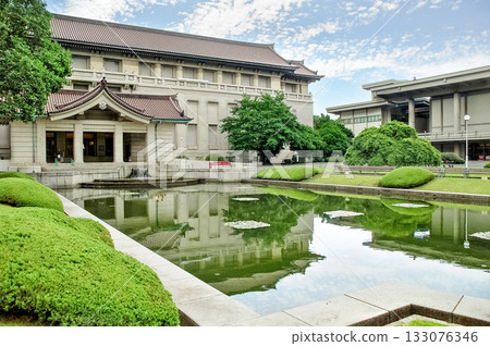 The main building of the Tokyo National Museum and the beautiful pond in the front garden, with a beautiful view of Ueno Park, where traditional Japanese architecture and modern architecture coexist in harmony The main building of the Tokyo National Museum and the beautiful pond in the front garden, with a beautiful view of Ueno Park, where traditional Japanese architecture and modern architecture coexist in harmony 133076346