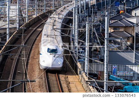 Nozomi Shinkansen bound for Tokyo Station. Scenery seen from Shishikan Amusement Park in early winter. 5. Higashi Ward, Okayama City, Okayama Prefecture. 133076543