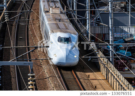 Kyushu Shinkansen Mizuho bound for Shin-Osaka Station. Scenery seen from Shishikan Amusement Park in early winter. 5. Higashi Ward, Okayama City, Okayama Prefecture. Kyushu Shinkansen Mizuho bound for Shin-Osaka Station. Scenery seen from Shishikan Amusement Park in early winter. 5. Higashi Ward, Okayama City, Okayama Prefecture. 133076551