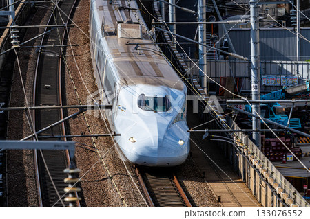 Kyushu Shinkansen Mizuho bound for Shin-Osaka Station. Scenery seen from Shishikan Amusement Park in early winter. 6. Higashi Ward, Okayama City, Okayama Prefecture. 133076552