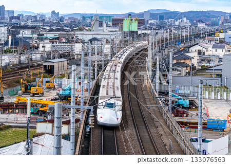 Nozomi Shinkansen bound for Hiroshima Station. Scenery from Shishikan Amusement Park in early winter 2. Higashi Ward, Okayama City, Okayama Prefecture. 133076563