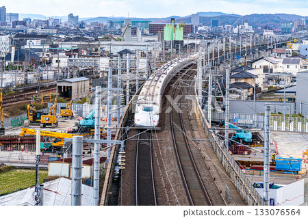 Nozomi Shinkansen bound for Hiroshima Station. Scenery seen from Shishikan Amusement Park in early winter. 3. Higashi Ward, Okayama City, Okayama Prefecture. 133076564