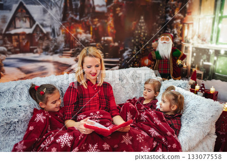 Mother reading Christmas story to children with santa background Mother reading Christmas story to children with santa background 133077558