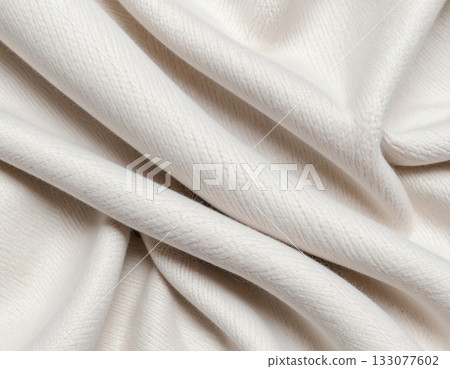 Lighting. Crisp details. Natural light color. Texture of premium white textile fabric. Premium cashmere material. Lighting. Crisp details. Natural light color. Texture of premium white textile fabric. Premium cashmere material. 133077602