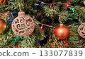 Christmas tree branches with beautiful balls and lights 133077839
