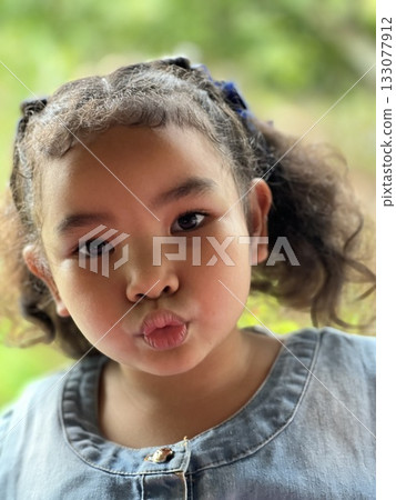 Portrait of a cute little Asian girl 133077912